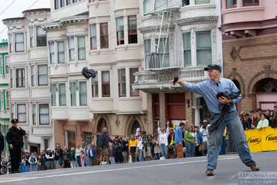 Race announcer extraordinaire Richard Fries throws gifts to the crowd.